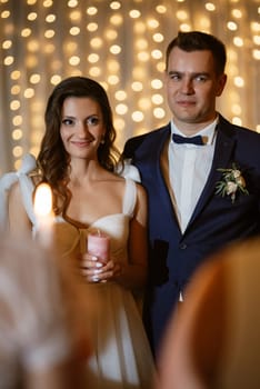 ceremony of passing the wedding fire from parents to children with lighting candles