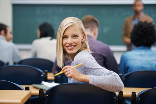 Her education is important to her. Portrait of a university student in a lecture hall