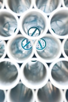 Bunches of PVC pipe sitting on palets at a wholesale pipe store.