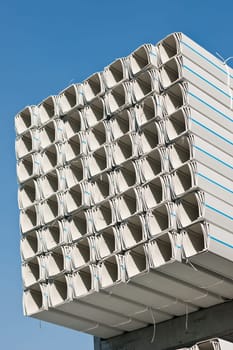 Bunches of PVC pipe sitting on palets at a wholesale pipe store.