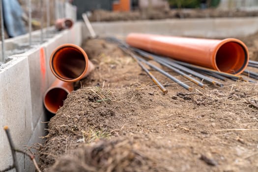 plastic pipe for sewage network in the base plate at the construction site.