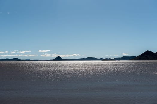 Reflections on the Gariep Dam. The dam is the largest in South Africa. It is in the Orange River on the border between the Free State and Eastern Cape Provinces