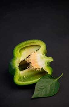 sweet pepper, green bell pepper on black background