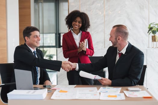 business holding hands, businessmen are agreeing on business together and shaking hands after a successful negotiation. Handshaking is a or congratulation.