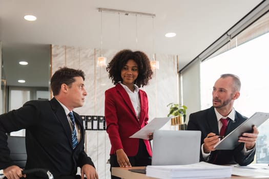 Diverse business team discussing project at corporate briefing in boardroom. colleagues meeting for brainstorming, sharing ideas, together. Teamwork concept.
