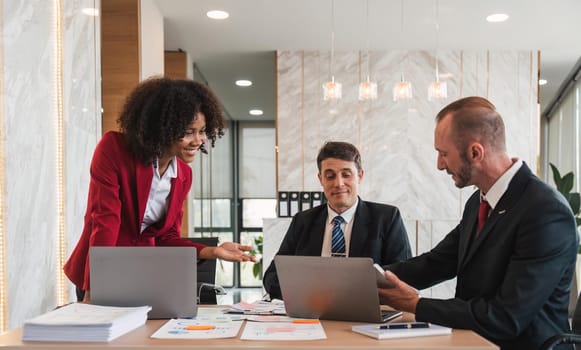 Business team Diverse colleagues gather brainstorm discuss financial statistics at office meeting. finance, teamwork ,data Graphs Charts concept.