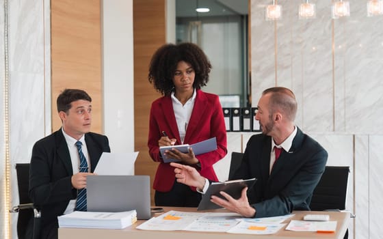 Diverse business team discussing project at corporate briefing in boardroom. colleagues meeting for brainstorming, sharing ideas, together. Teamwork concept.