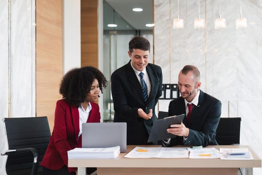 Diverse business team discussing project at corporate briefing in boardroom. colleagues meeting for brainstorming, sharing ideas, together. Teamwork concept.