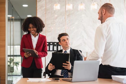 Diverse business team discussing project at corporate briefing in boardroom. colleagues meeting for brainstorming, sharing ideas, together. Teamwork concept.