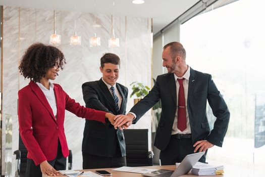 businessman joining hand unity , business team touching hands together after complete a deal in meeting. unity teamwork partnership corporate concept..