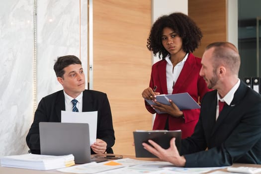 Diverse business team discussing project at corporate briefing in boardroom. colleagues meeting for brainstorming, sharing ideas, together. Teamwork concept.
