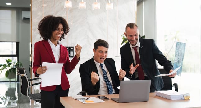 portrait of businesspeople team sitting in conference together in an office with intimate and excited the success on laptop. Idea for a good relationship of teamwork in business.