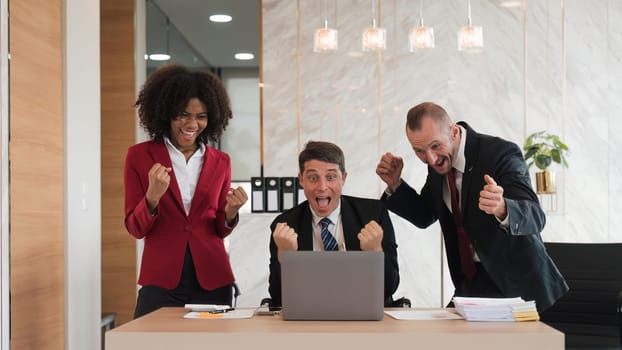 portrait of businesspeople team sitting in conference together in an office with intimate and excited the success on laptop. Idea for a good relationship of teamwork in business.