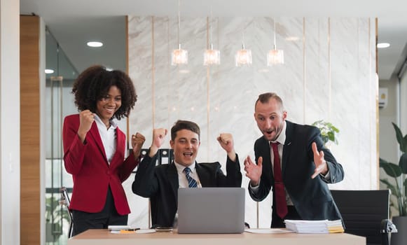 portrait of businesspeople team sitting in conference together in an office with intimate and excited the success on laptop. Idea for a good relationship of teamwork in business.