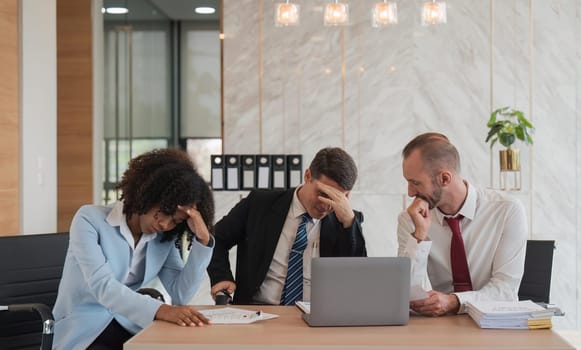 Stressed overwhelmed businesspeople feels tired at corporate meeting, exhausted businesspeople suffering from headache touching temples at team briefing, stress at meeting room.