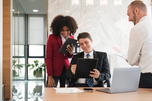 Diverse business team discussing project at corporate briefing in boardroom. colleagues meeting for brainstorming, sharing ideas, together. Teamwork concept.