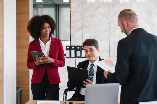 Diverse business team discussing project at corporate briefing in boardroom. colleagues meeting for brainstorming, sharing ideas, together. Teamwork concept.