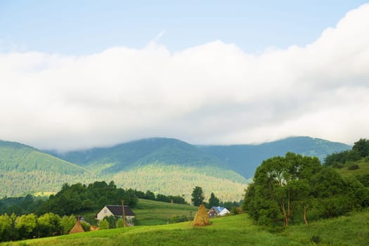 Haystack summer in the beautiful village Ukrainian Carpathians