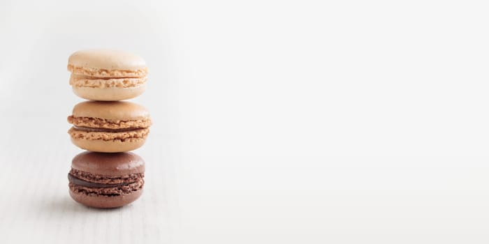 Colorful pastel eco handmade natural macaroons on white background. Gift for 8 March, International Women's Day, Valentine Day. Horizontal banner closeup with a copyspace