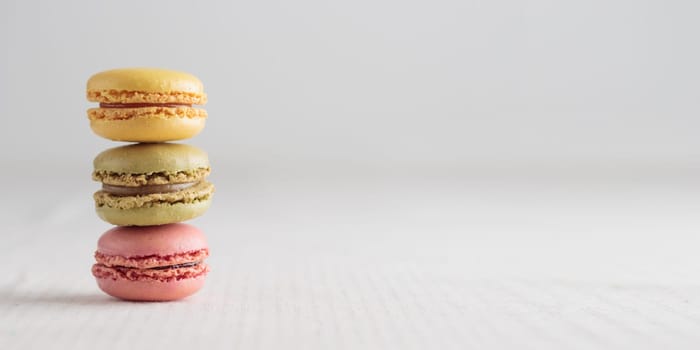 Colorful pastel eco handmade natural macaroons on white background. Gift for 8 March, International Women's Day, Valentine Day. Horizontal banner closeup with a copyspace