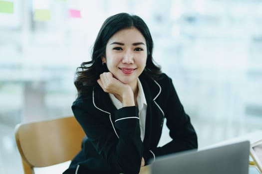 Portrait of a female business owner with a smiling face successfully invests his business in a conference room.