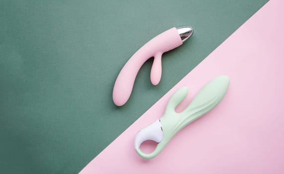 A set of toys for adults on a green and pink background