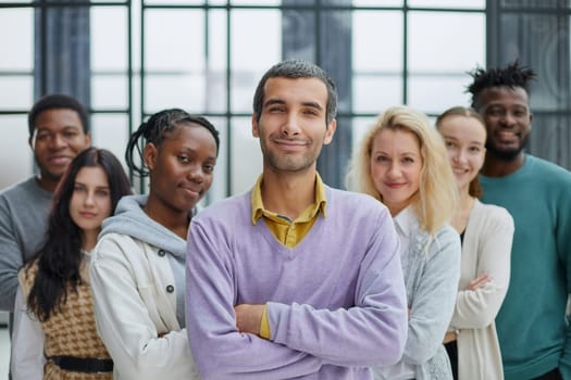 Group of business people standing at the window of a modern office