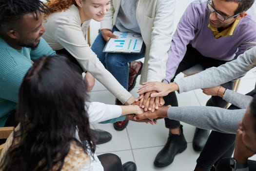 close-up of a business team sitting holding hands