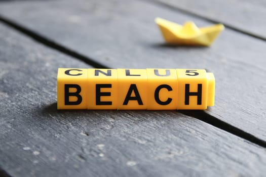 Beach creative concept, inscription on yellow cubes.