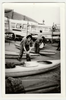 THE CZECHOSLOVAK SOCIALIST REPUBLIC - CIRCA 1980s: Vintage photo shows young canoeist prepares to canoeing.