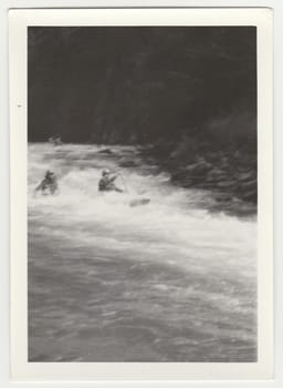 THE CZECHOSLOVAK SOCIALIST REPUBLIC - CIRCA 1980s: Vintage photo shows young canoeists on the river.