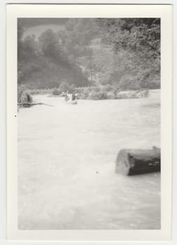 THE CZECHOSLOVAK SOCIALIST REPUBLIC - CIRCA 1980s: Vintage photo shows young canoeists on the river.