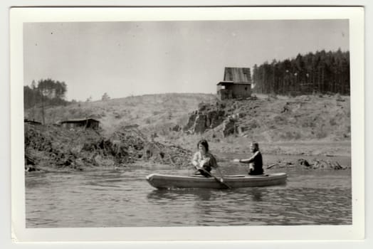 THE CZECHOSLOVAK SOCIALIST REPUBLIC - CIRCA 1980s: Vintage photo shows young canoeists on the river.