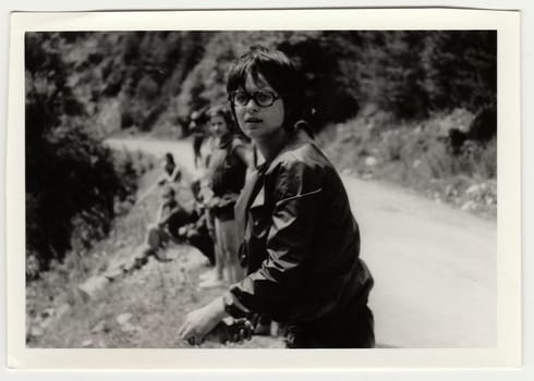 THE CZECHOSLOVAK SOCIALIST REPUBLIC - CIRCA 1980s: Vintage photo shows young boy with glasses outdoors.