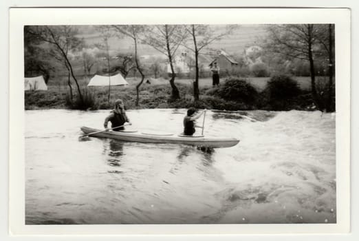 THE CZECHOSLOVAK SOCIALIST REPUBLIC - CIRCA 1980s: Vintage photo shows young canoeists on the river.