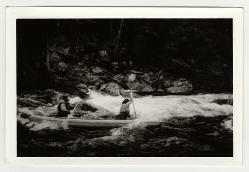 THE CZECHOSLOVAK SOCIALIST REPUBLIC - CIRCA 1980s: Vintage photo shows young canoeists on the river.