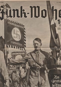 BERLIN, GERMANY - APRIL 16, 1939: Reproduction of magazine page shows Adolf Hitler.