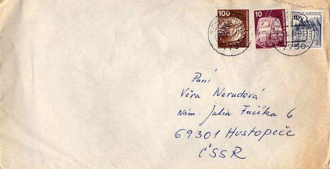 GERMANY - CIRCA 1980s: A vintage used envelope and stamps. Rich stain and paper details. Can be used as background.