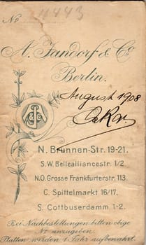 BERLIN, GERMANY - AUGUST, 1908: Back of vintage photo. Rich stain and paper details. Can be used as background.