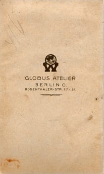 BERLIN, GERMANY - CIRCA 1920s: Back of vintage photo. Rich stain and paper details. Can be used as background.