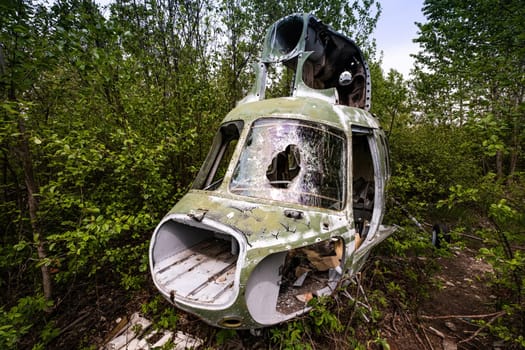 Destroyed military old helicopter at the airfield. Soviet Union army technique
