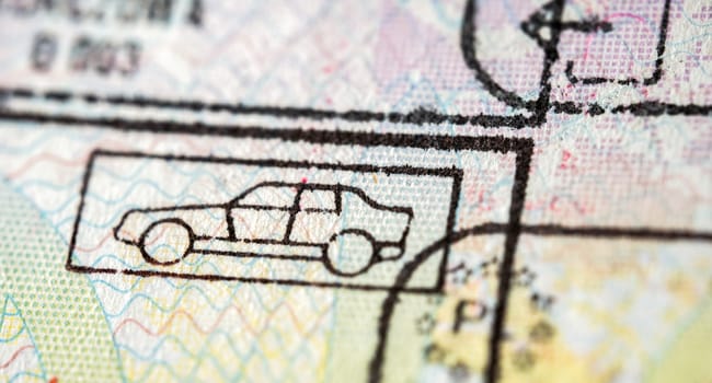International travel visa passport stamp. Close up macro detail of European Union border control customs admission stamps with car symbol