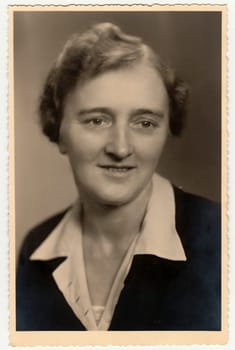 THE CZECHOSLOVAK REPUBLIC - CIRCA 1940s: Vintage photo shows woman. Black white studio portrait.