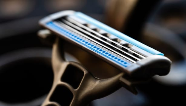 Brand new shaving razor for man beard hygiene closeup. Daily care shaver with sharp metal blades macro