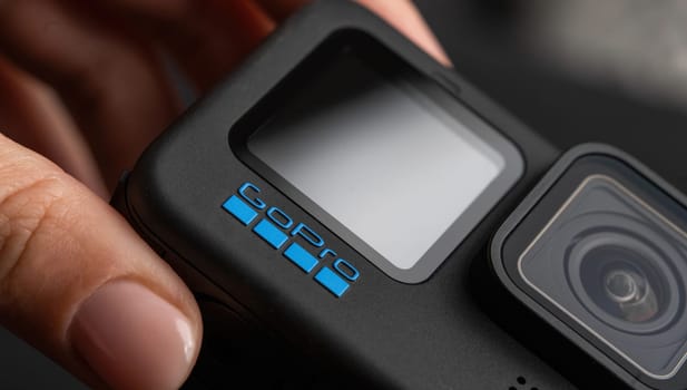 Poznan, Poland - 30 November 2022: Action camera GoPro hero 11 in girls hands, close up view