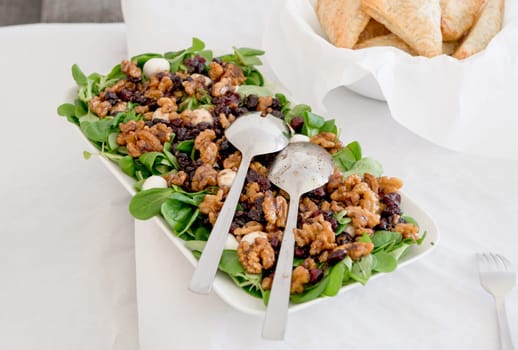 Vegetarian salad with beets and feta. Served in a square bowl. Top view. High quality photo