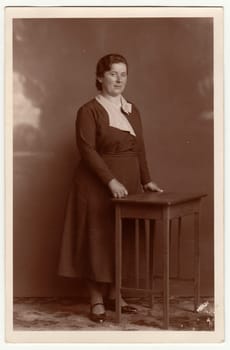 EILENBURG, GERMANY - CIRCA 1920s: Vintage photo shows mature woman. Studio photo with sepia tint.