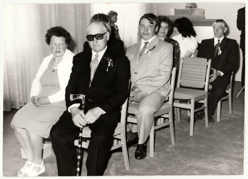 THE CZECHOSLOVAK SOCIALIST REPUBLIC - CIRCA 1980: Vintage photo shows wedding guests during wedding ceremony. Black white antique photo.