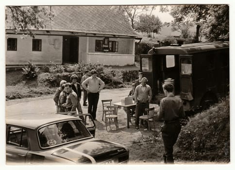 THE CZECHOSLOVAK SOCIALIST REPUBLIC - CIRCA 1980s: Vintage photo shows people prepare to village celebration. Antique black & white photo.