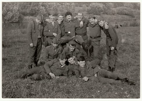 THE CZECHOSLOVAK SOCIALIST REPUBLIC - CIRCA 1970s: Vintage photo shows soldiers pose outdoors. Black & white antique photo.